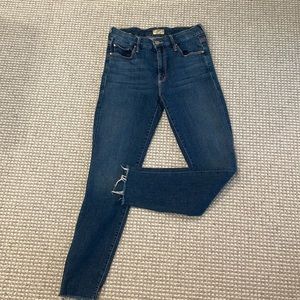 Mother size 28 skinny jeans with frayed bottoms.